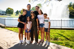 Family posing for photo at the College of the Ozarks campus
